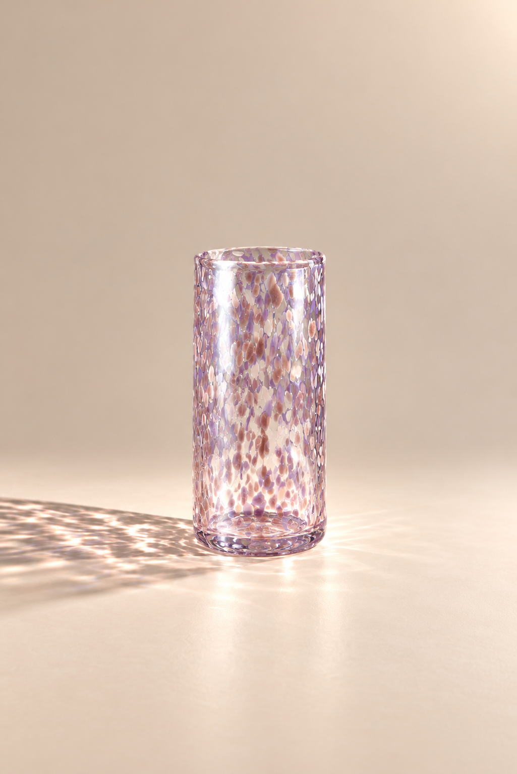 Lotus Flower highball — single glass in a warm beige studio